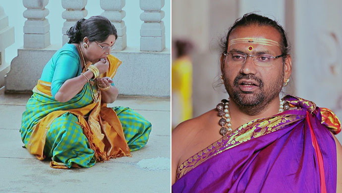 A Still Of Annapoorna And The Priest At The Temple
