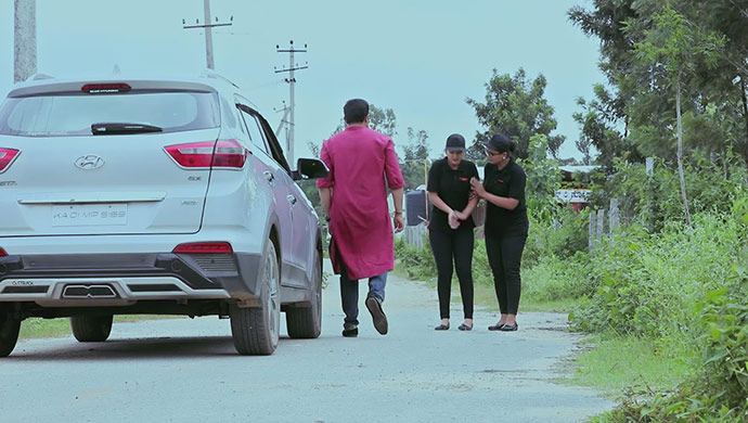 A Still Of Chandru, Kamali And Ningi