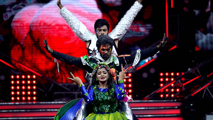 An Exclusive Still Of Adithi And Vicky Performing On Stage