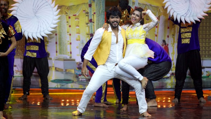 An Exclusive Still Of Tejas And Pranathi Performing On Stage