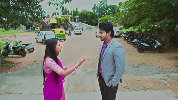 A Still Of Amulya Scolding Vedanth While He Grins At Her