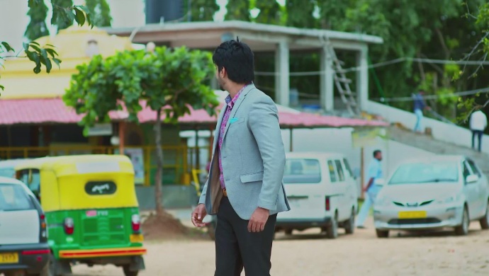 A Still Of Vedanth Looking Around For Amulya