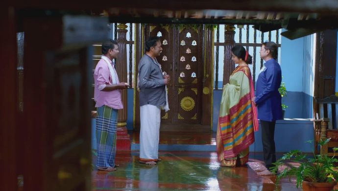 Raghu and Akhila talk to the villagers